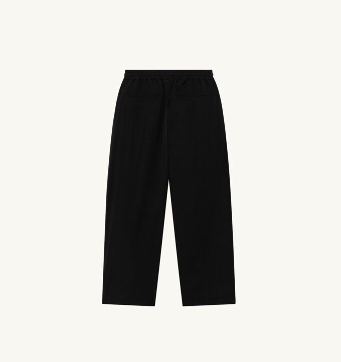PANTALONES DE NYLON CON LOGO TONAL UNISEX PANTALONES DE NYLON CON LOGO TONAL UNISEX
