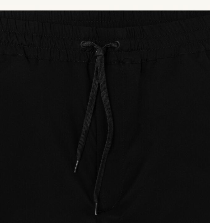 PANTALONES DE NYLON CON LOGO TONAL UNISEX PANTALONES DE NYLON CON LOGO TONAL UNISEX