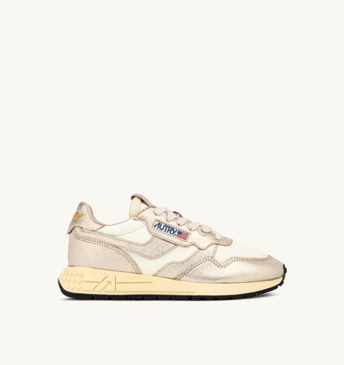 ZAPATILLAS BAJAS REELWIND DE NYLON BLANCO Y PIEL METALIZADA EN TONO DORADO ZAPATILLAS BAJAS REELWIND DE NYLON BLANCO Y PIEL METALIZADA EN TONO DORADO