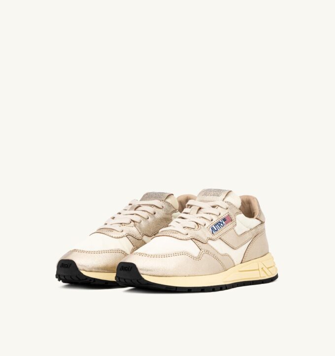 ZAPATILLAS BAJAS REELWIND DE NYLON BLANCO Y PIEL METALIZADA EN TONO DORADO ZAPATILLAS BAJAS REELWIND DE NYLON BLANCO Y PIEL METALIZADA EN TONO DORADO