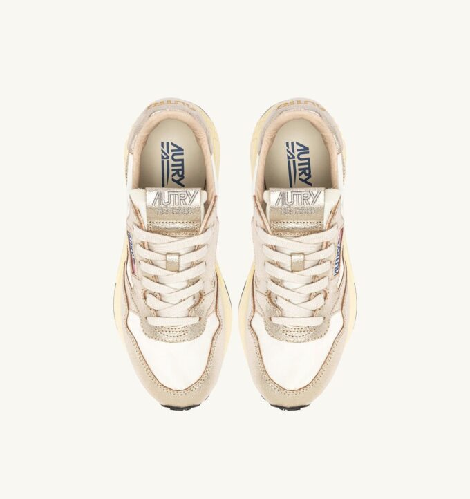 ZAPATILLAS BAJAS REELWIND DE NYLON BLANCO Y PIEL METALIZADA EN TONO DORADO ZAPATILLAS BAJAS REELWIND DE NYLON BLANCO Y PIEL METALIZADA EN TONO DORADO